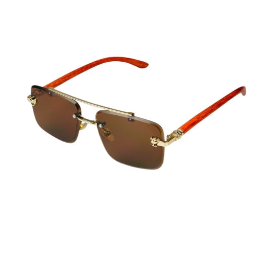 Sunglasses with gold frame and red arms on a white background