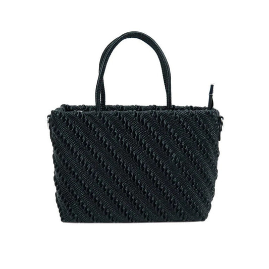 Black woven handbag on a white background