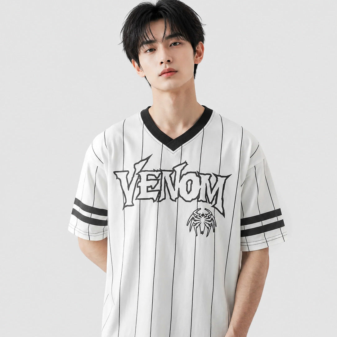 Person wearing a white sports jersey with 'Venom' branding on a light gray background